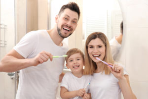 Young Family Brushing Teeth
